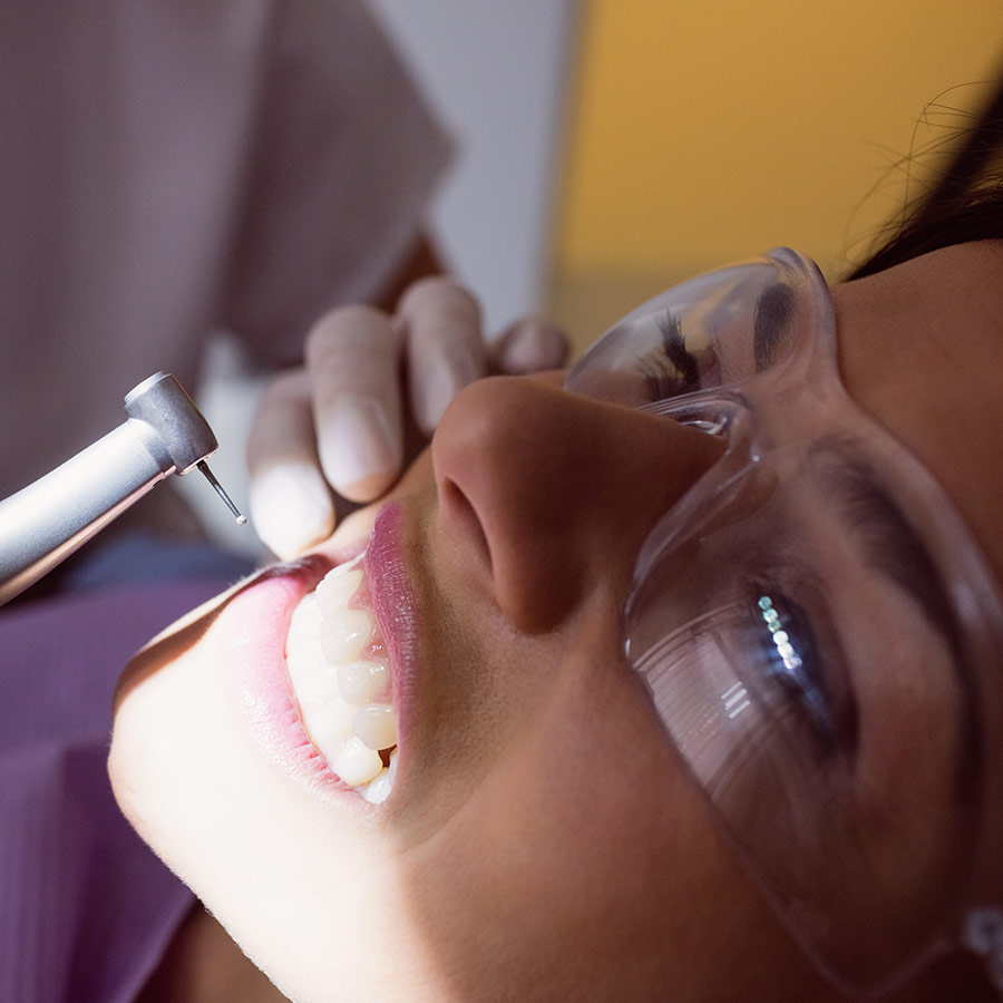 dentist-examining-female-patient