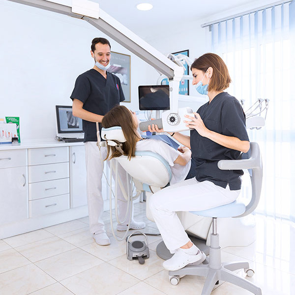 female-dentist-scanning-patient-s-teeth-with-x-ray-machine-modern-dental-clinic-1-1